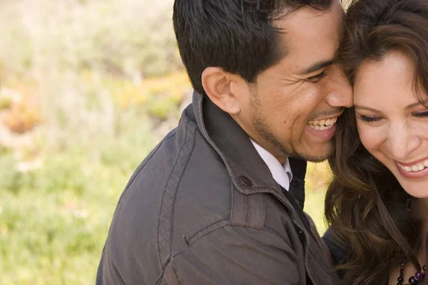 Beautiful Hispanic couple laughing and smiling. — Stock Photo, Image