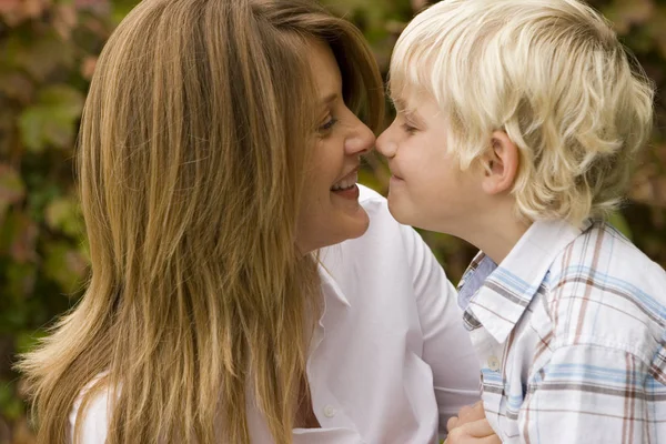 Happy mother hugging her son outside. — Stock Photo, Image