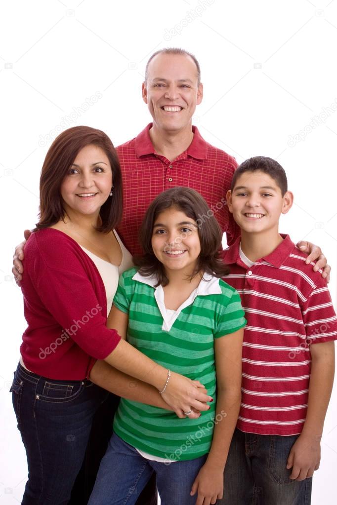 Hispanic family smiling isolated on white.