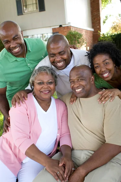 Mature African American couple and their adult kids. — Stock Photo, Image
