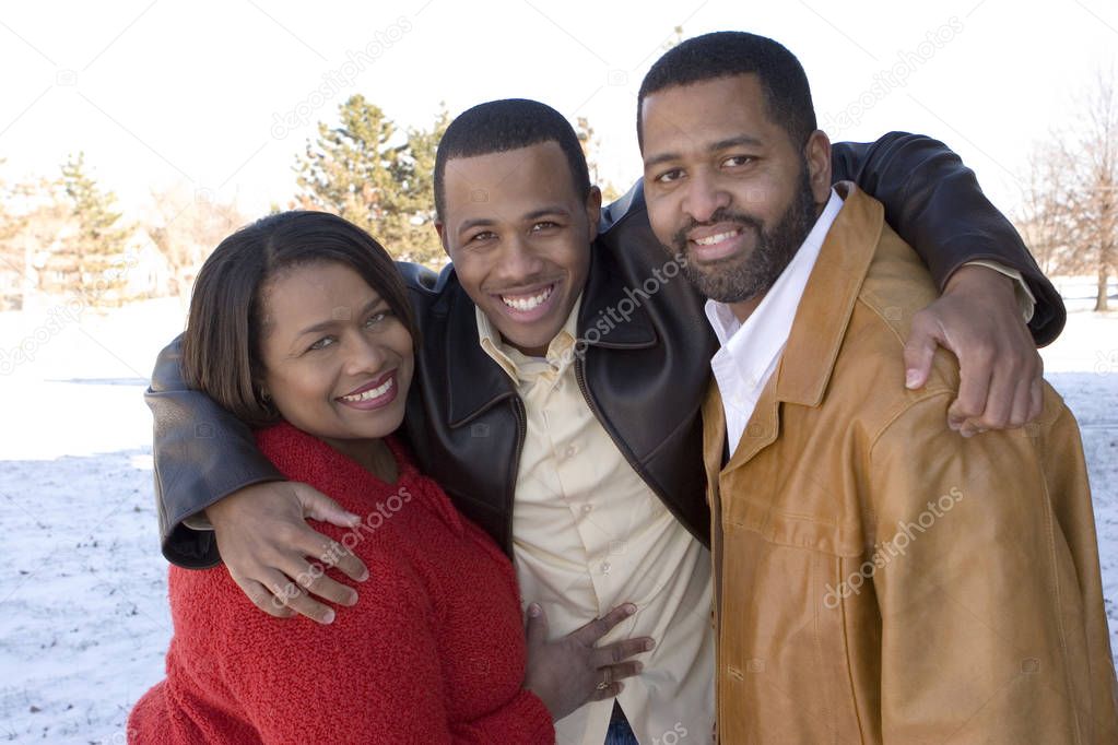 African American family and their adult son.