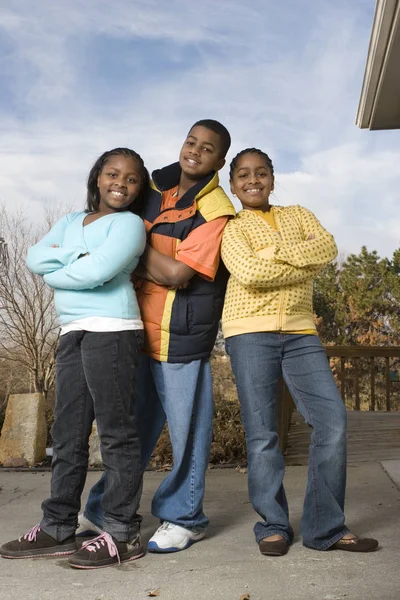 Happy African American brother and sisters smiling. — Stock Photo, Image