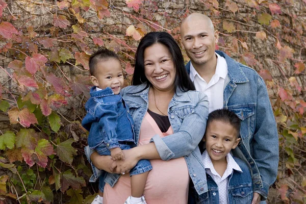Loving Asain parents and their sons smiling. — Stock Photo, Image