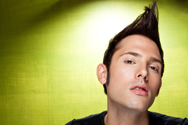 Young punk rocker staring and looking mean.