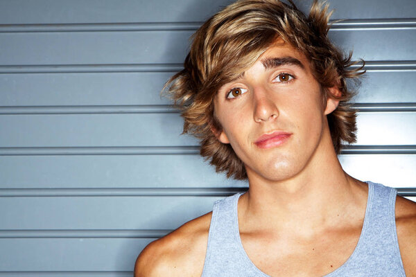 Handsome young muscular man isolated.