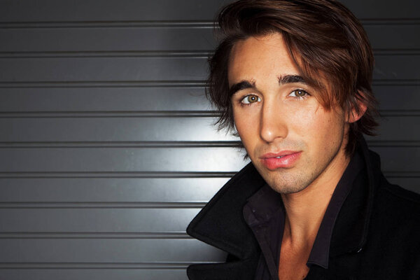 Handsome young muscular man isolated.