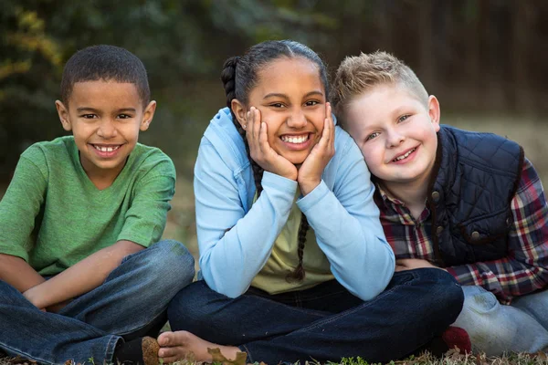 Diverse group of kids outside at a park. — Stock Photo, Image