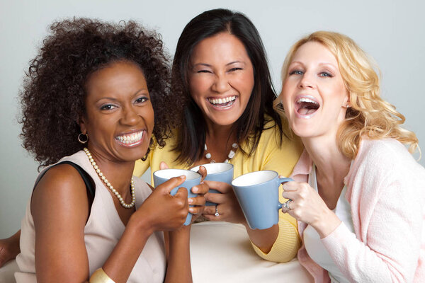 Diverse group of friends having coffee and talking.