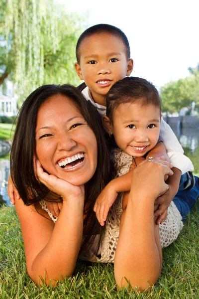 Asian mother and her childern. — Stock Photo, Image