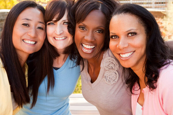 Diverse group of women talking and laughing.