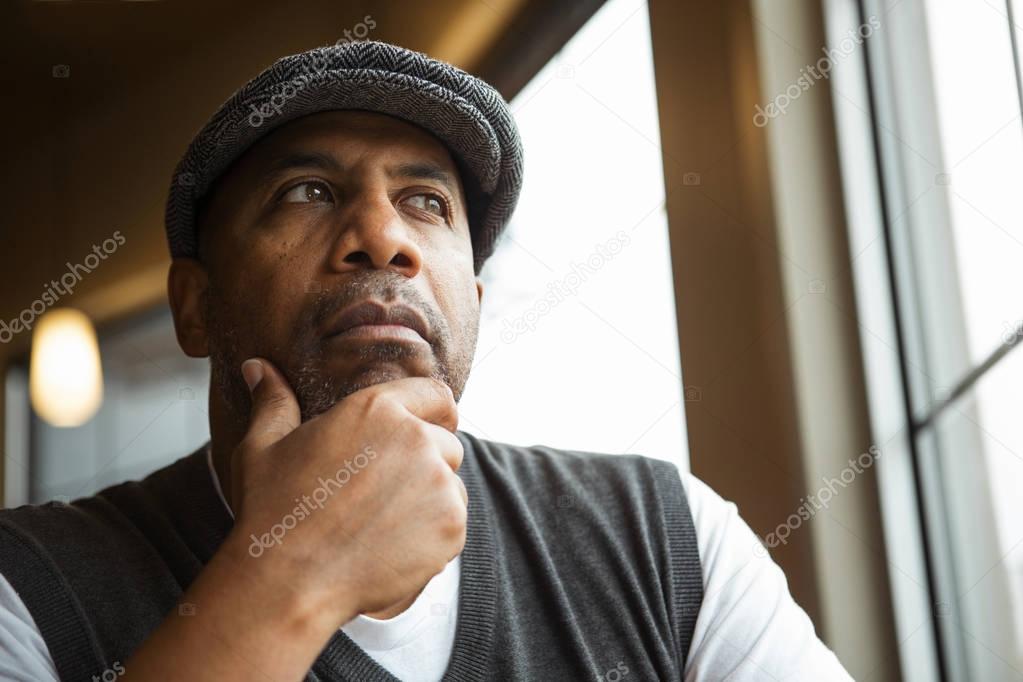 Portrait of a mature African American man in deep thought.