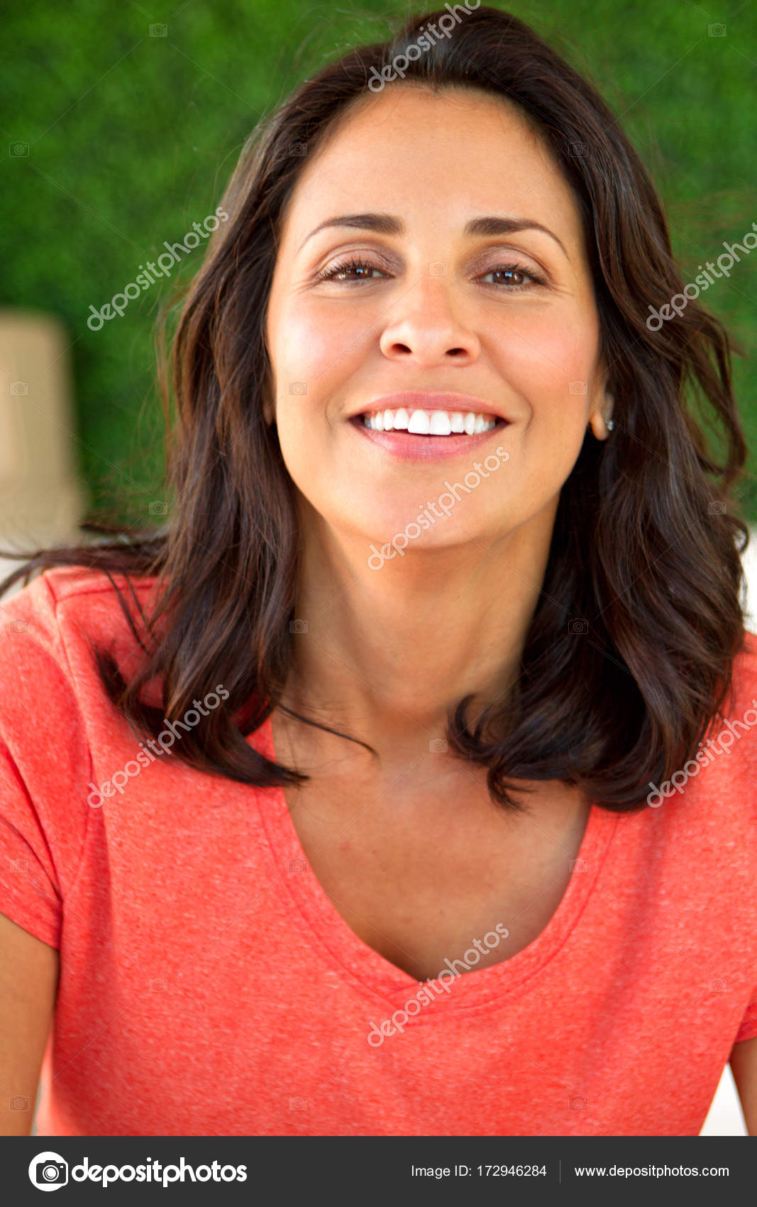 Beautiful Mature Hispanic Woman Smiling Stock Photo By ©pixelheadphoto