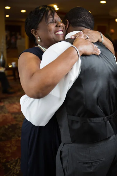 Mother and hugging her adult son at his wedding. — Stock Photo, Image