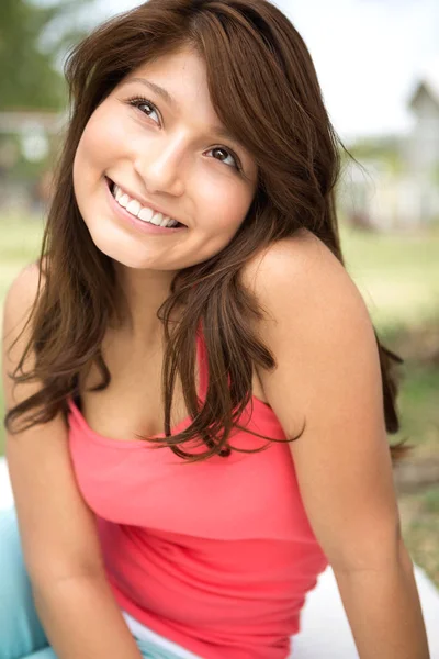 Young Hispanic girl smiling outside. — Stock Photo, Image