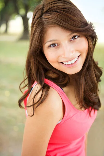 Young Hispanic girl smiling outside. — Stock Photo, Image