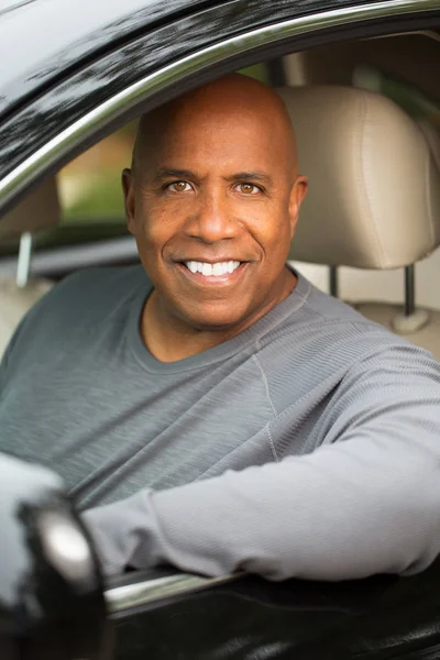 African American man driving.