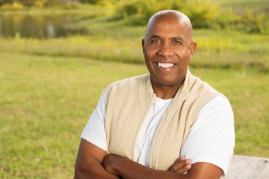 African American mature man smiling. clipart