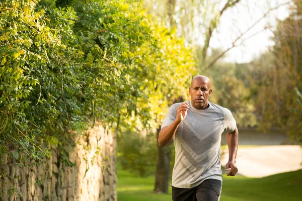 Fit African American man running. — Stock Photo, Image