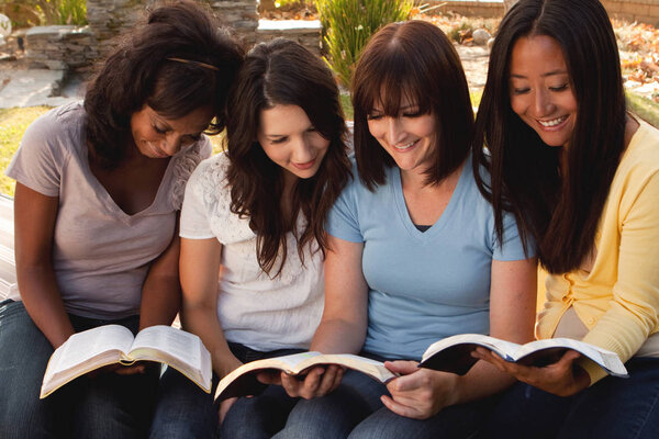 Diverse group of women talking and laughing.