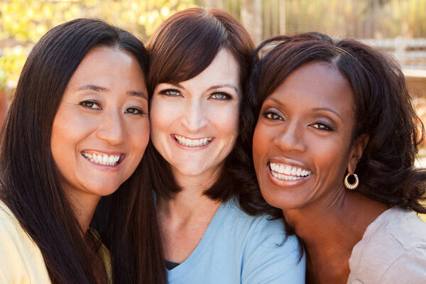 Diverse group of women talking and laughing.