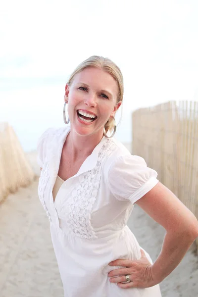 Portrait of a confident woman smiling.