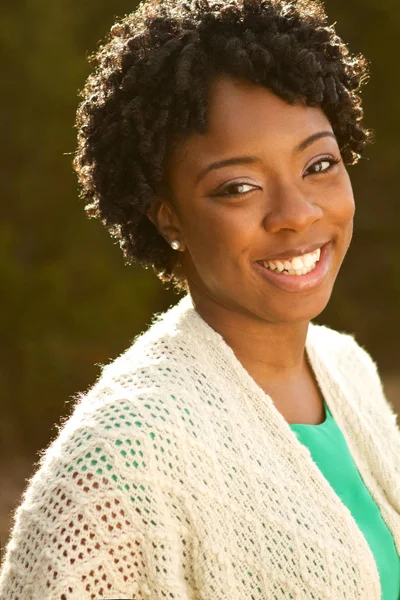 African American woman smiling outside. — Stock Photo, Image