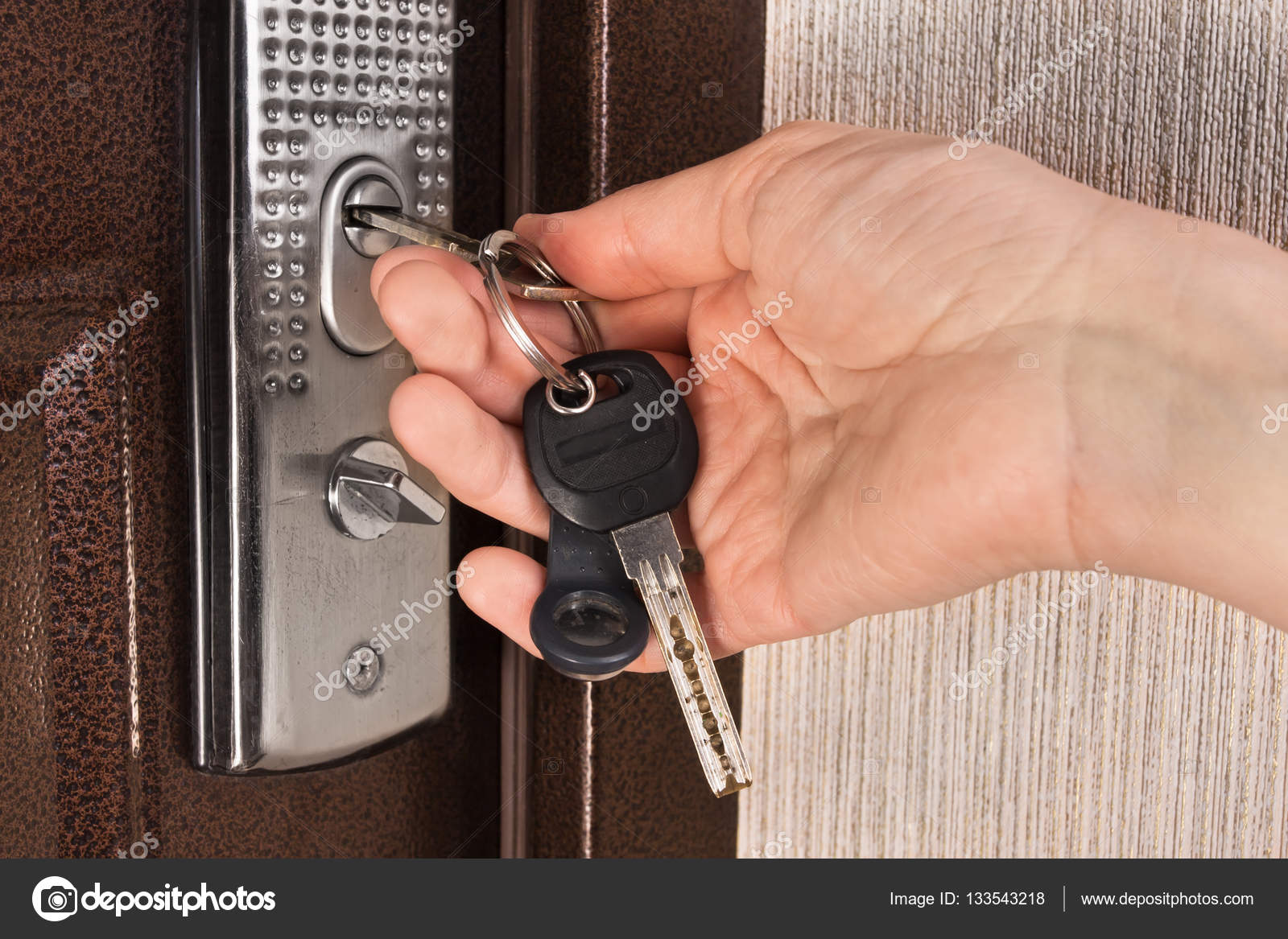 Hand Unlocking The Door With Key Stock Photo C Rodimovpavel