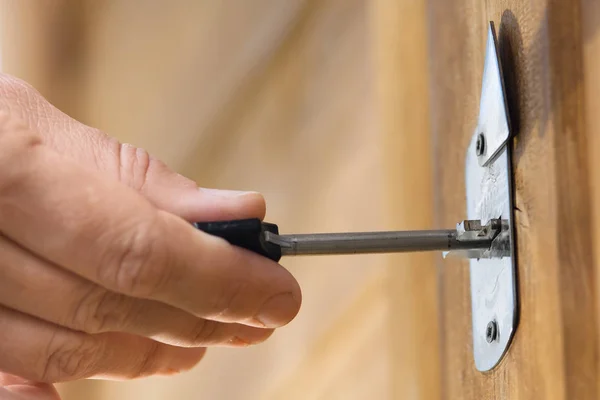 stock image hands unlocking door