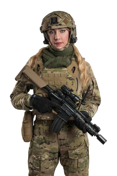 Female soldier in tactical uniform with rifle. Shot in studio