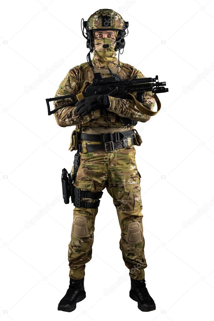 Soldier holding assault rifle. Uniform conforms to special services of the Russian Federation. Shot in studio. Isolated with clipping path on white background