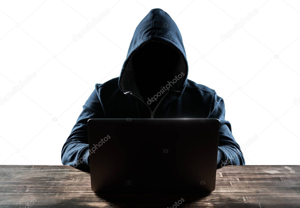 Hacker in front of his computer. Dark face. Isolated on white background