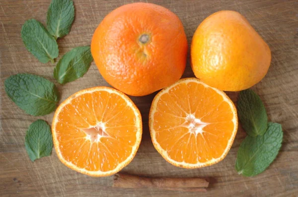 Several mandarin oranges cut in half