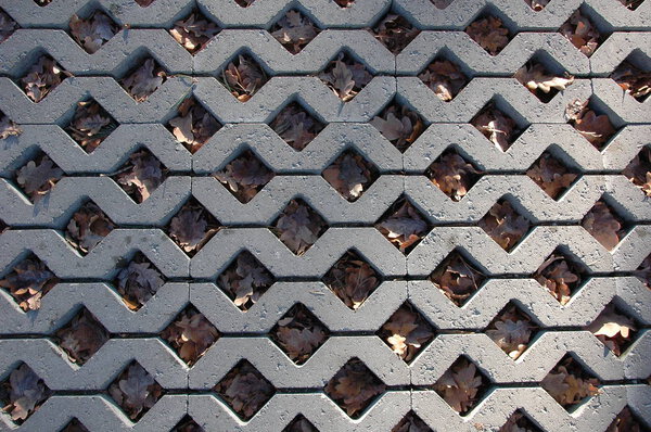 Abstract background: gray paving stones in the form of rhombuses.