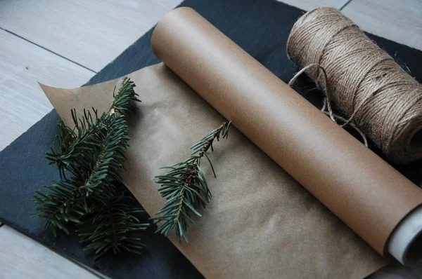 Packaging materials for gifts: parchment paper, twine, decor.