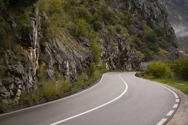 Beautiful asphalt road with bends in the mountains.
