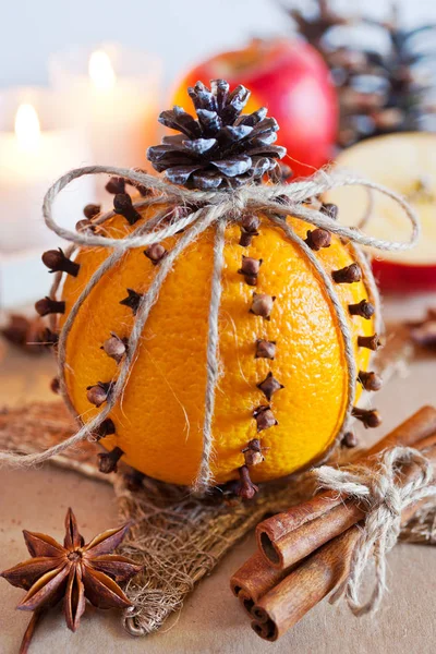 Traditional Czech christmas - decoration - orange decorated with cloves and cinnamon and apple. Home-made decoration — Stock Photo, Image