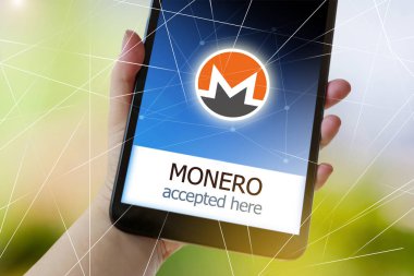 sanal para cryptocurrency bir el - smartphone ekranında Monero burada kabul