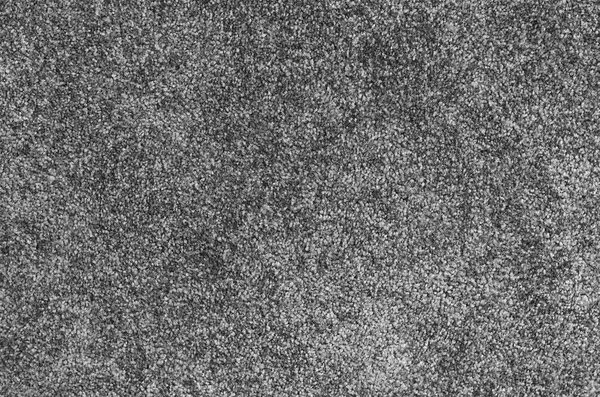Seamless monochrome grey carpet texture background from above