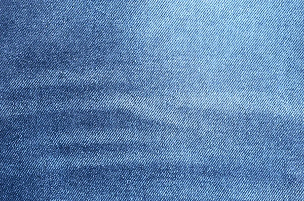 Navy blue denim background closeup. Jeans texture