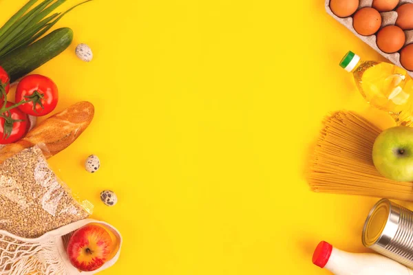 Food packaging on yellow background. Quarantine food delivery home. Flatlay banner with copyspace.