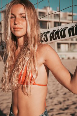 girl standing on the beach. golden hour. california lifestyle