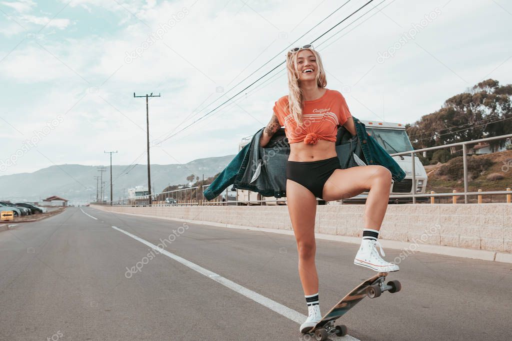 skater girl in california with camper in the background