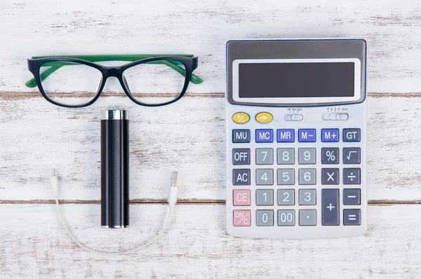 Top view of calculator and glasses on the accountant white table — Stock Photo, Image
