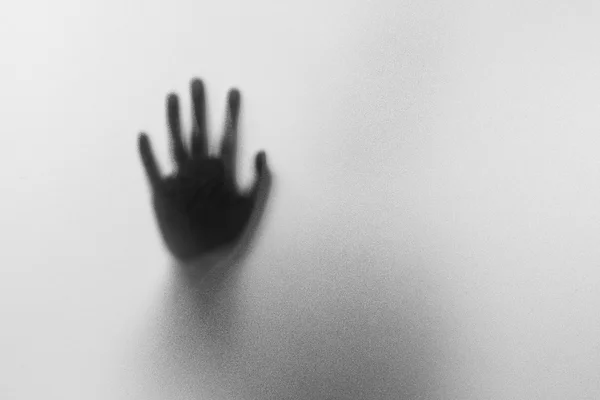 Shadow hands of the Man behind frosted glass.Blurry hand abstrac — Stock Photo, Image