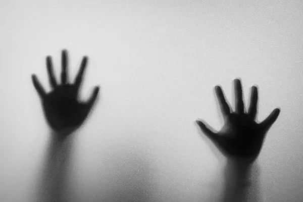 Shadow blur hands of the Man behind frosted glass.Blurry hand ab — Stock Photo, Image