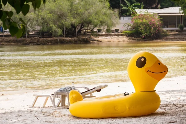 Yellow Duck swim tube on the beach Inflatable duck.Fantasy Swim