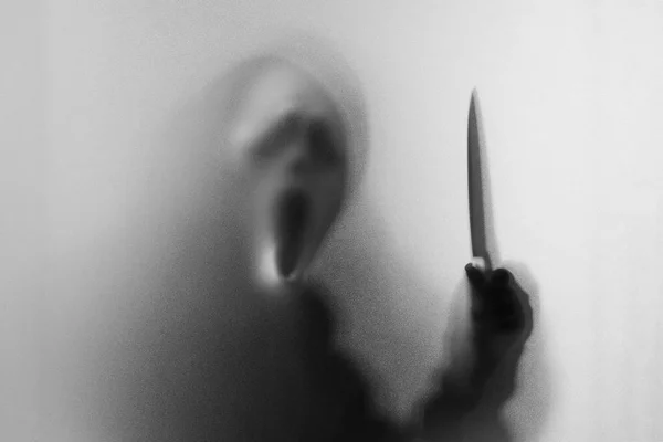 Shadow blur of horror man in screaming mask and show knife in hi — Stock Photo, Image