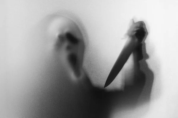 Shadow blur of horror man in screaming mask and show knife in hi — Stock Photo, Image