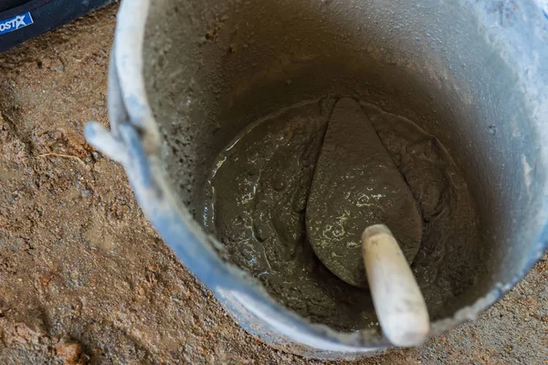 Pick up a trowel and cement mix concrete is compacted sand.