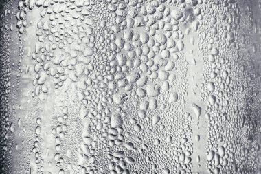 Şişenin kenarına su damlıyor. Arkaplan & Doku.